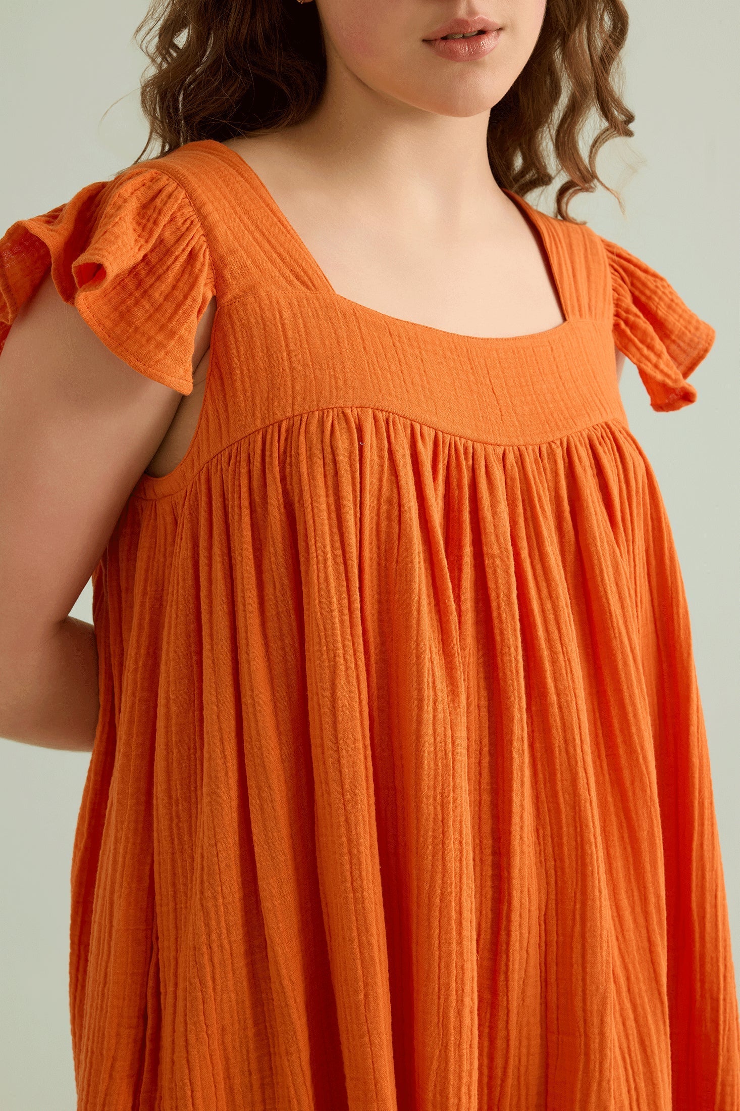 Ava's Hope Babydoll Dress In Orange